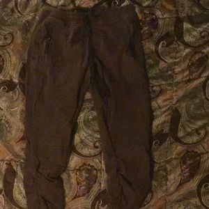 Maroon jeans with scrunched in the size is medium and the brand is Rocawear